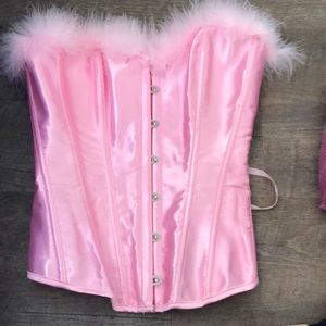Pink corset with feather detail on the front